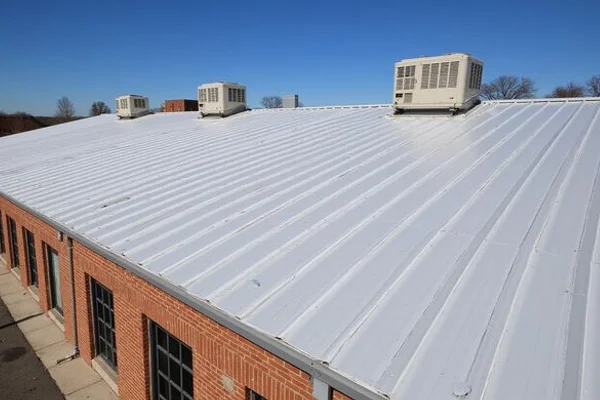 Standing seam metal roof installation on commercial building in Lancaster